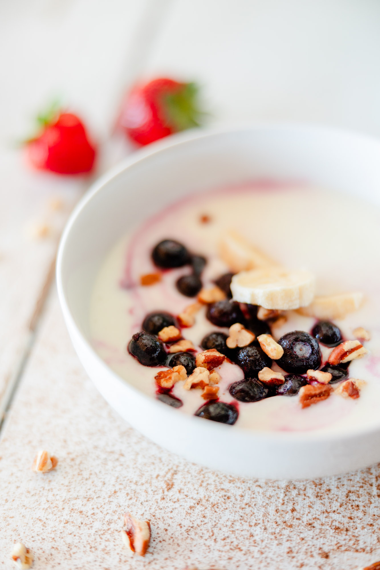 Image of Milk Kefir with blueberries, pecans, banana slices, and strawberries